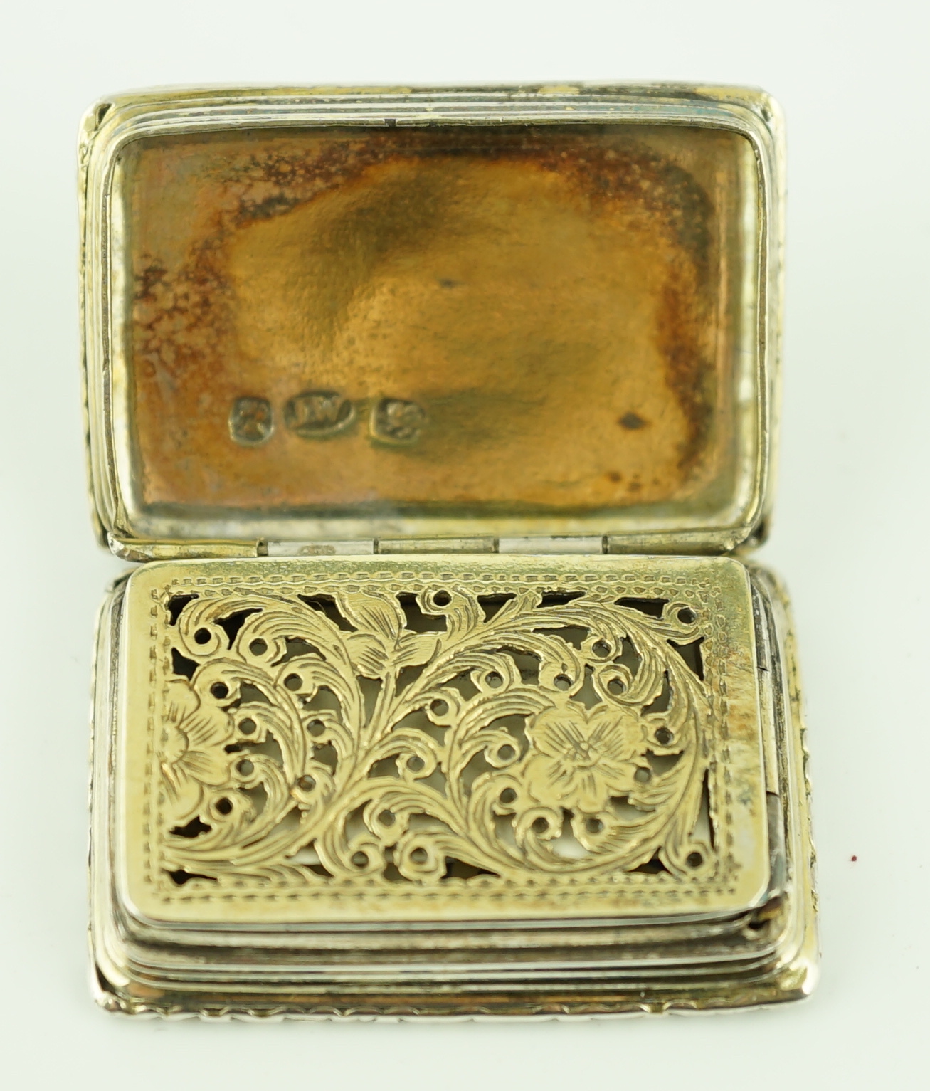 A William IV engine turned silver gilt rectangular vinaigrette, by Joseph Wilmore